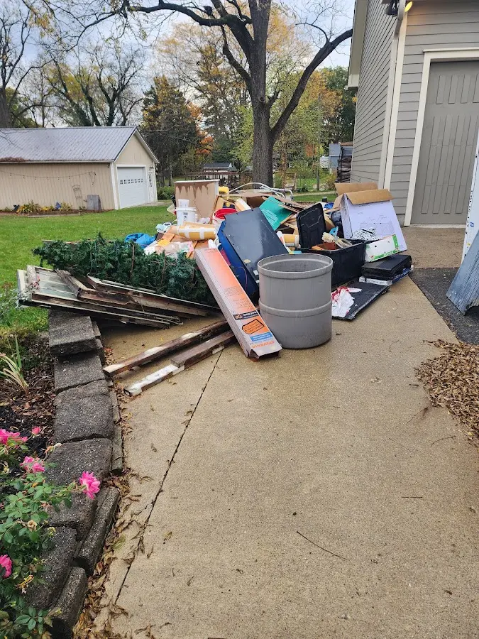 Dumpster being loaded with debris for Residential Dumpster Rental in Margaret